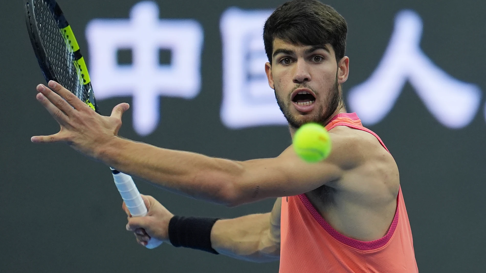 Carlos Alcaraz of Spain returns a shot from Karen Khachanov of Russia during the China Open tennis tournament held at the National Tennis Center in Beijing, Monday, Sept. 30, 2024. (AP Photo/Ng Han Guan)