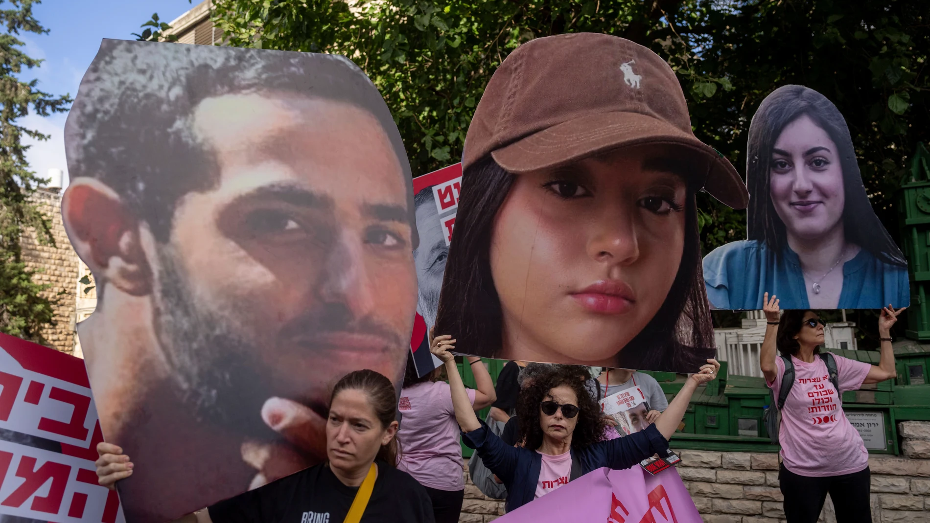 Families and supporters of Israeli hostages held by Hamas in Gaza hold photos of their loved ones during a protest calling for their return outside the prime minister's house in Jerusalem, Monday. Sept. 30, 2024. (AP Photo/Ohad Zwigenberg)