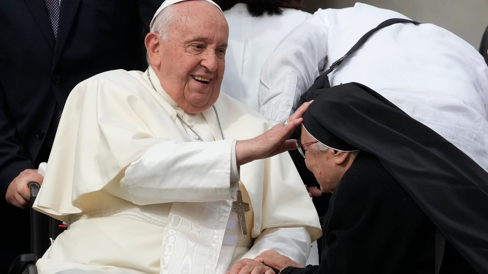 Pope Francis meets a nun at the end of his weekly general audience in St. Peter's Square, at the Vatican, Wednesday, Oct. 9, 2024. (AP Photo/Andrew Medichini)