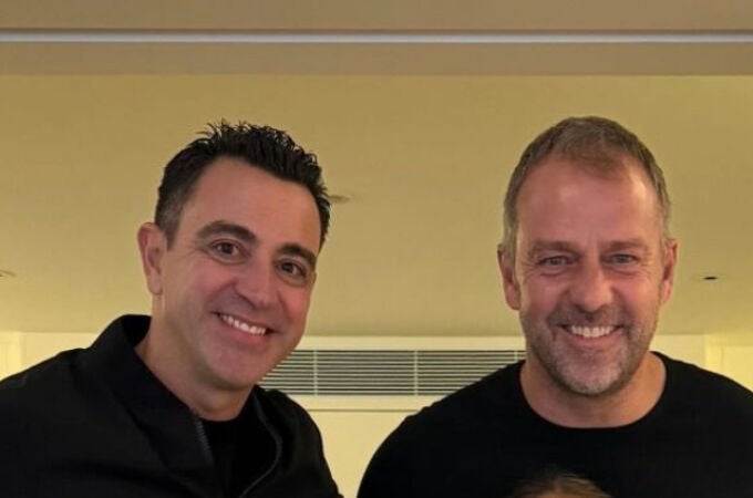 Xavi Hernández y Hansi Flick