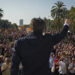 Catalan independence leader and former President Carles Puigdemont addresses supporters after his arrival near the Catalan parliament to allegedly attend the investiture debate in Barcelona, Spain, Thursday, Aug. 8, 2024. 