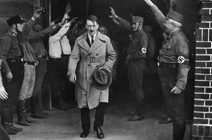Adolf Hitler, leader of the National Socialists, leaves the party's Munich, Germany headquarters