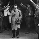 Adolf Hitler, leader of the National Socialists, leaves the party's Munich, Germany headquarters