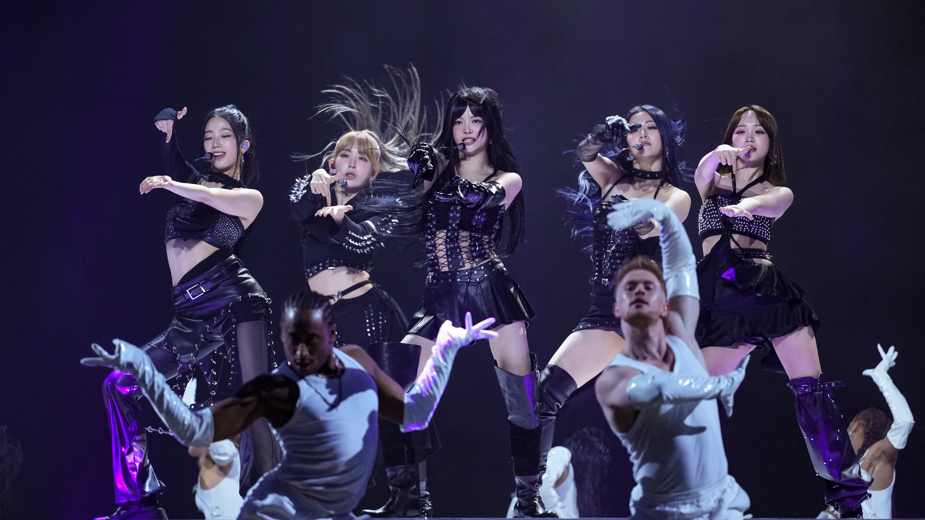 Kazuha, from left, Sakura Miyawaki, Hong Eunchae, Huh Yunjin, and Kim Chaewon, from the group 'Le Sserafim' perform during the MTV European Music Awards in Manchester, England, Sunday, Nov. 10, 2024. (Scott A Garfitt/Invision/AP)