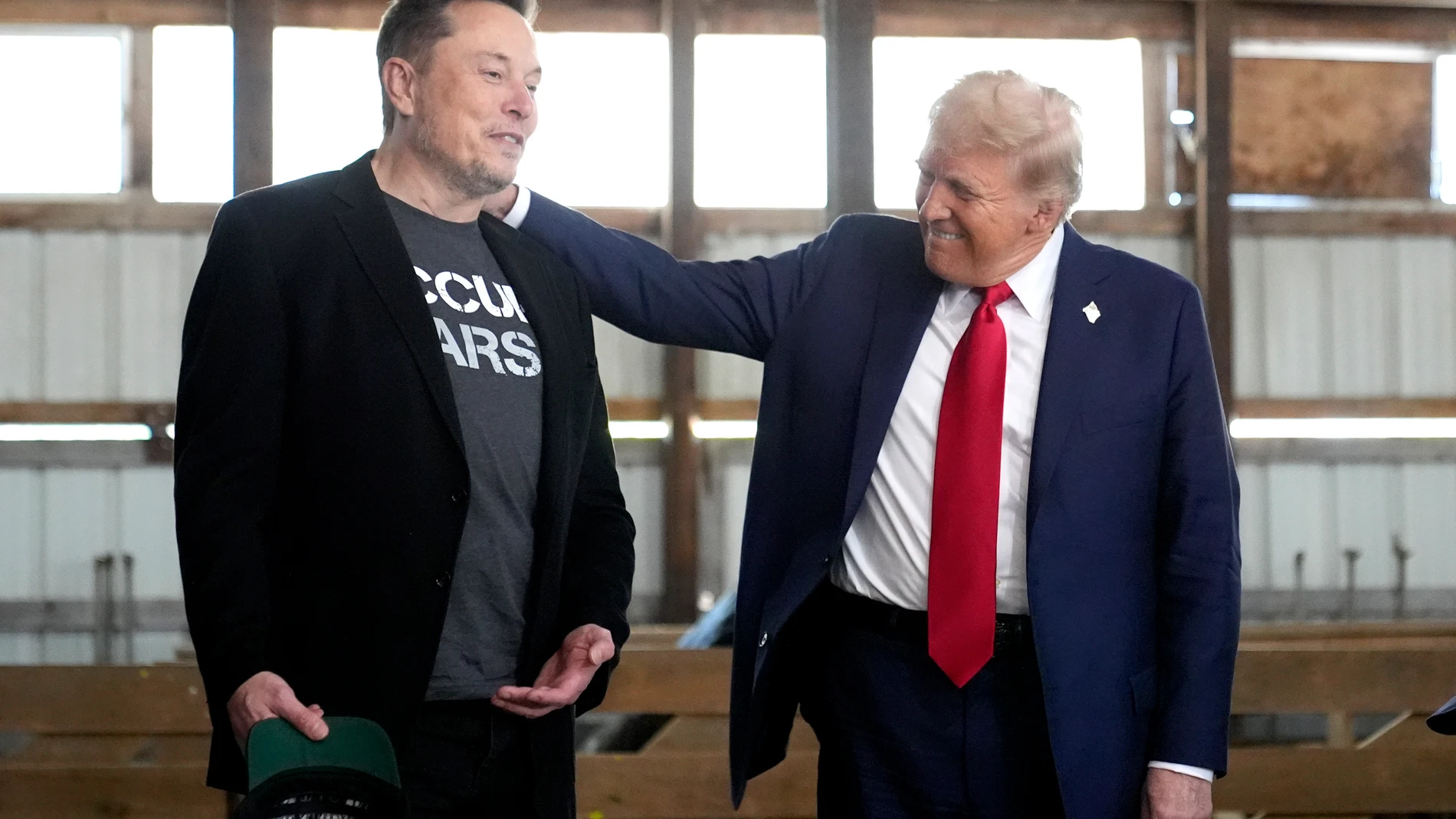 FILE - Tesla and SpaceX CEO Elon Musk, left, and Republican presidential nominee former President Donald Trump attend a campaign event at the Butler Farm Show on Oct. 5, 2024, in Butler, Pa. (AP Photo/Alex Brandon, File)
