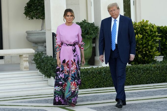 Former President Donald Trump, right, arrives with Melania Trump for a GOP fundraiser, Saturday