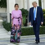 Former President Donald Trump, right, arrives with Melania Trump for a GOP fundraiser, Saturday