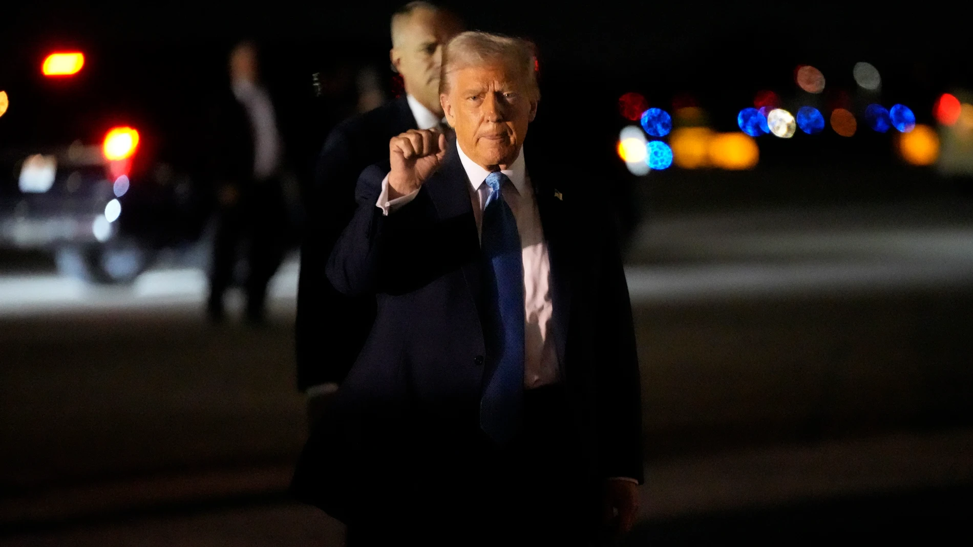 President Donald Trump gestures as he arrives at Palm Beach International Airport in West Palm Beach, Fla., Friday, Jan. 31, 2025, en route to his Mar-a-Lago estate in Palm Beach.(AP Photo/Ben Curtis)
