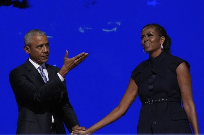Former President Barack Obama hugs former first lady Michelle Obama as he is introduced during the Democratic National Convention Tuesday, Aug. 20, 2024, in Chicago. 