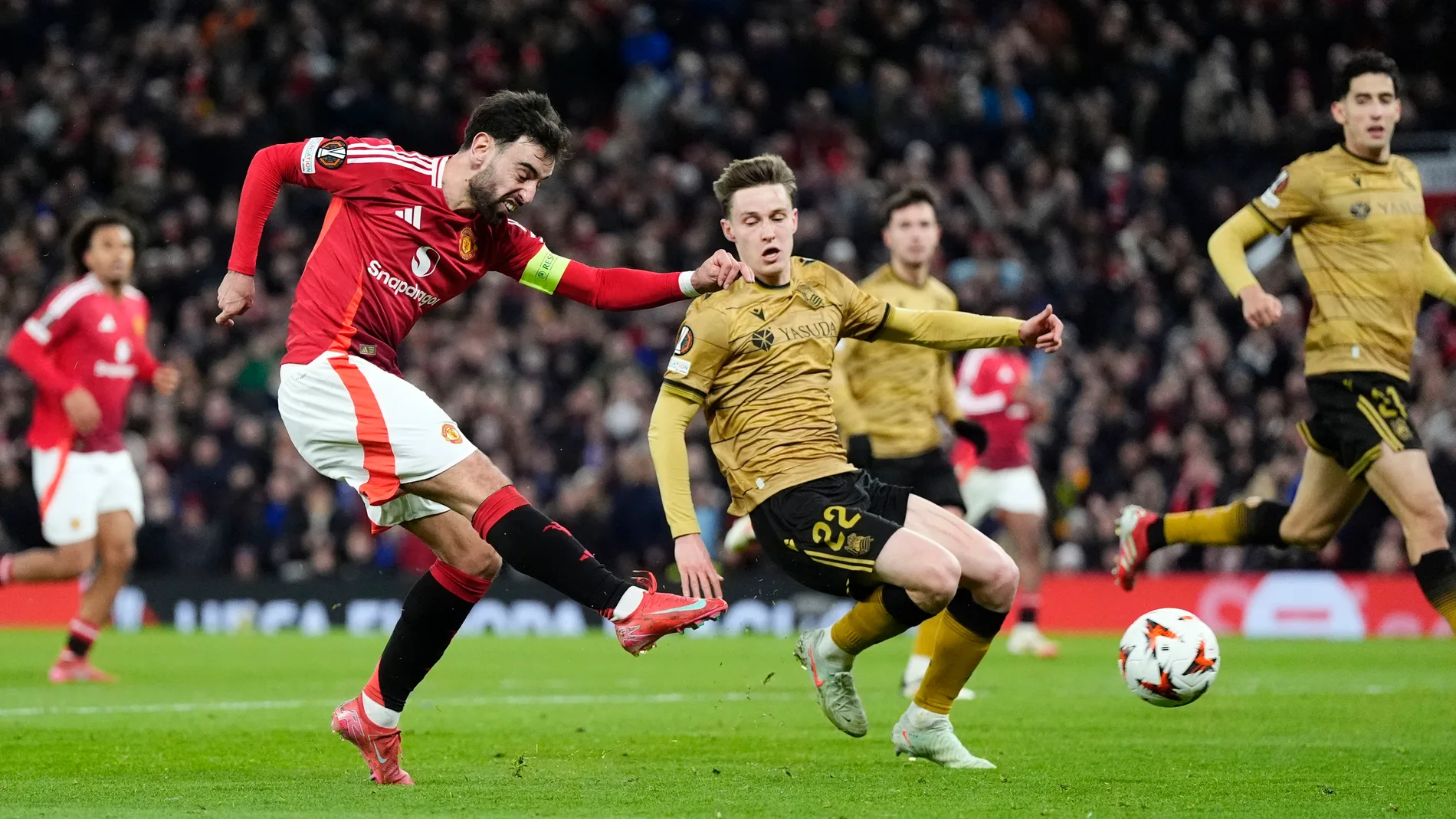 Manchester United's Bruno Fernandes scores his third goal of the game during the Europa League soccer match between Manchester United and Real Sociedad at Old Trafford stadium in Manchester, England, Thursday, March 13, 2025 . (Nick Potts//PA via AP)