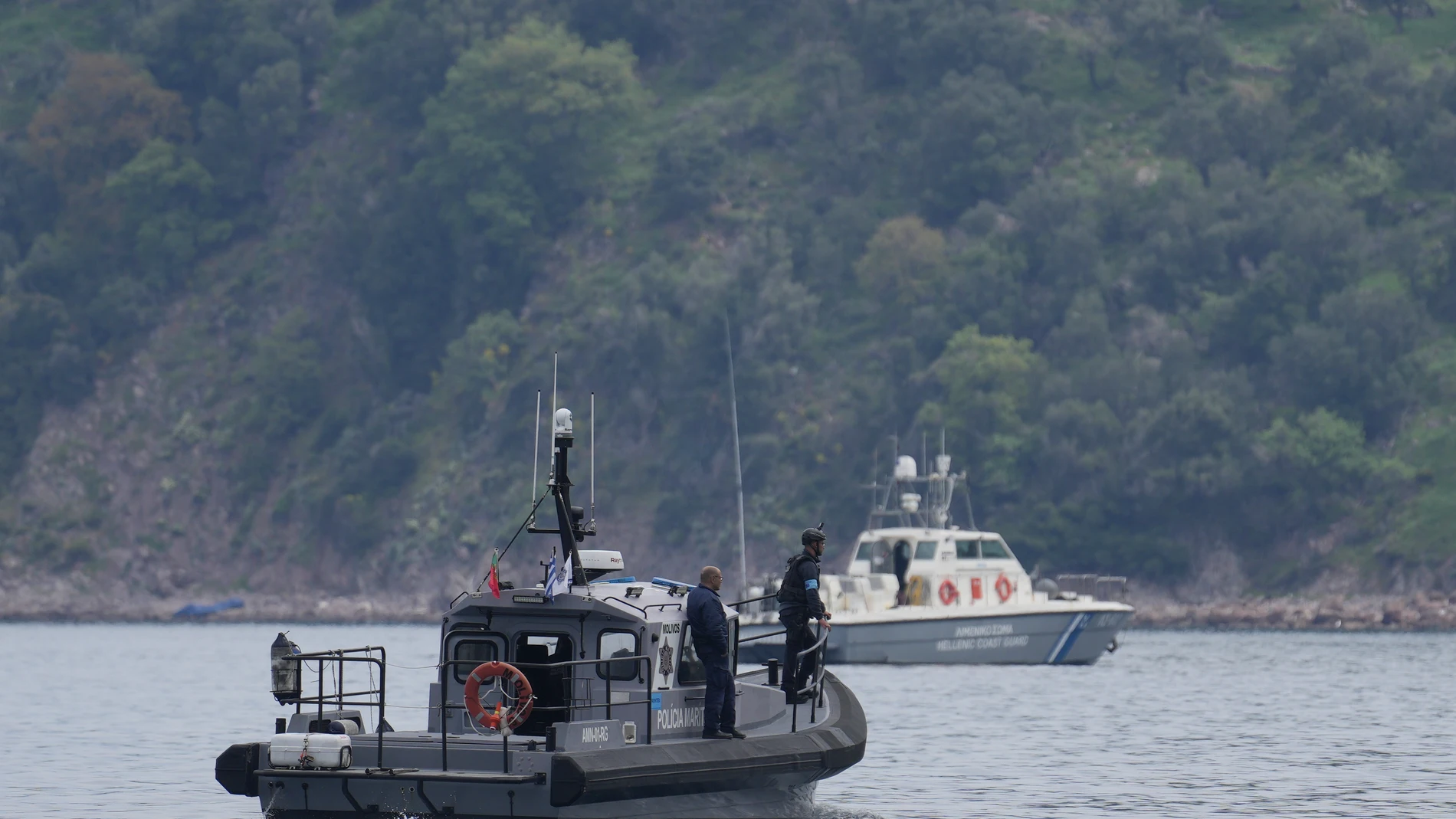 Frontex, foreground, and Greek coast guard vessels take part in a search and rescue operation, after the capsizing of a boat carrying migrants, off the coast on the northeastern Aegean Sea island of Lesbos, Greece, Thursday, April 3, 2025. (AP Photo/Panagiotis Balaskas)