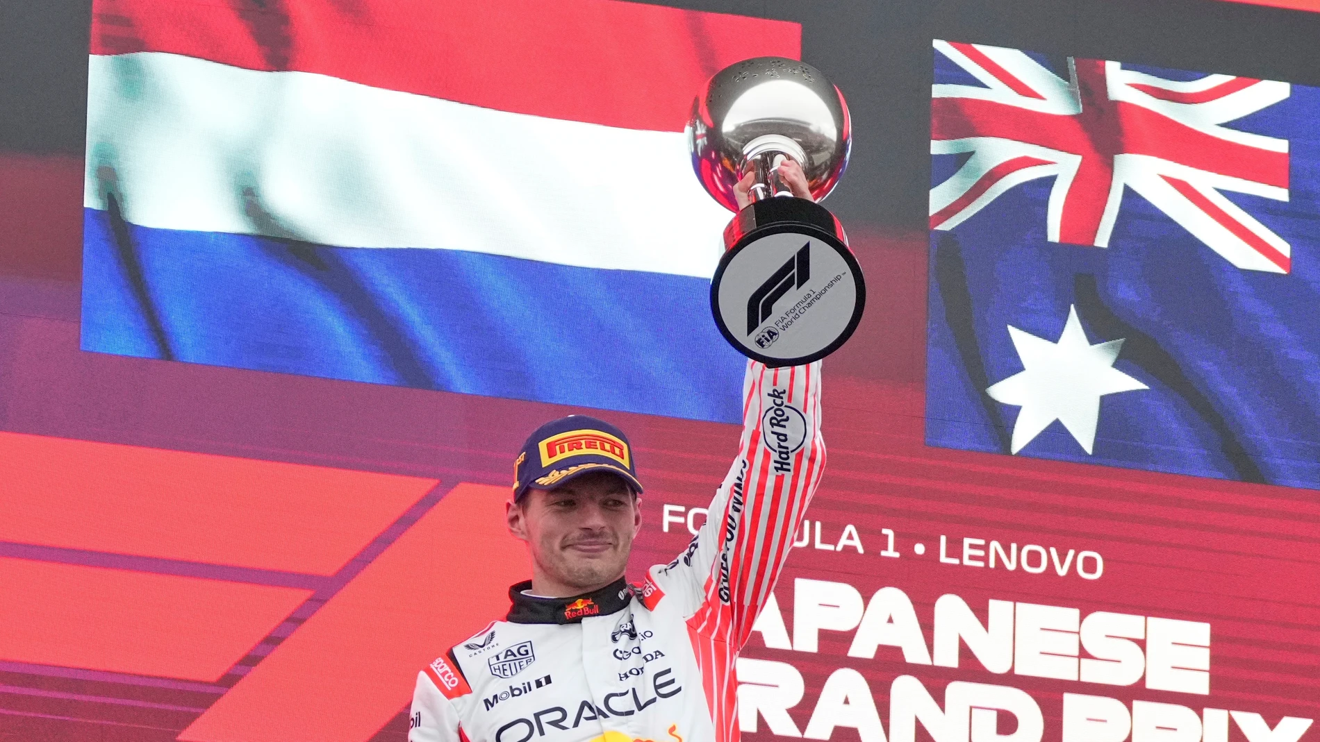 Red Bull driver Max Verstappen of the Netherlands celebrates with his trophy after winning the Japanese Formula One Grand Prix at the Suzuka Circuit in Suzuka, central Japan, Sunday, April 6, 2025. (AP Photo/Shuji Kajiyama, Pool)