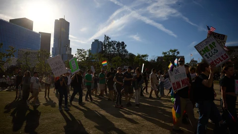 Protesters take part in a protest against President Trump