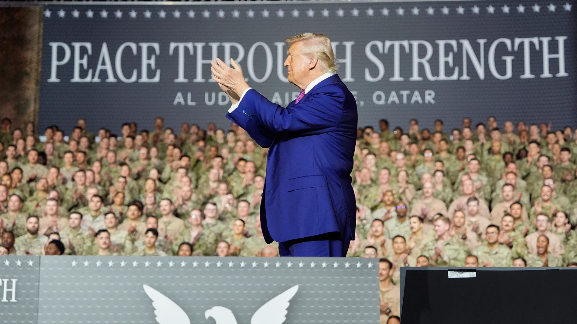 President Donald Trump applauds on stage at the Al Udeid Air Base, Thursday, May 15, 2025, in Doha, Qatar. (AP Photo/Alex Brandon)
