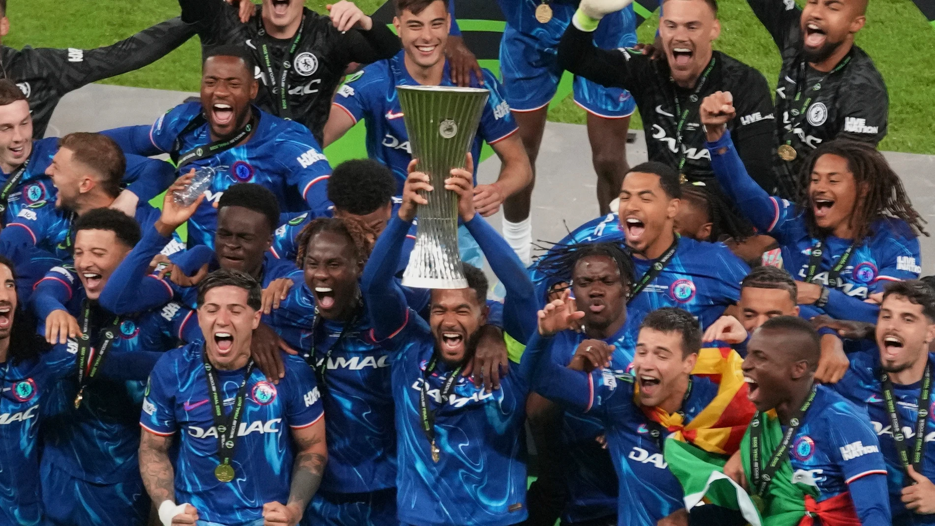Chelsea's Reece James holds the trophy as he celebrates with his teammates after winning the Europa Conference League final soccer match between Real Betis and Chelsea in Wroclaw, Poland, Wednesday, May 28, 2025. (AP Photo/Darko Vojinovic)