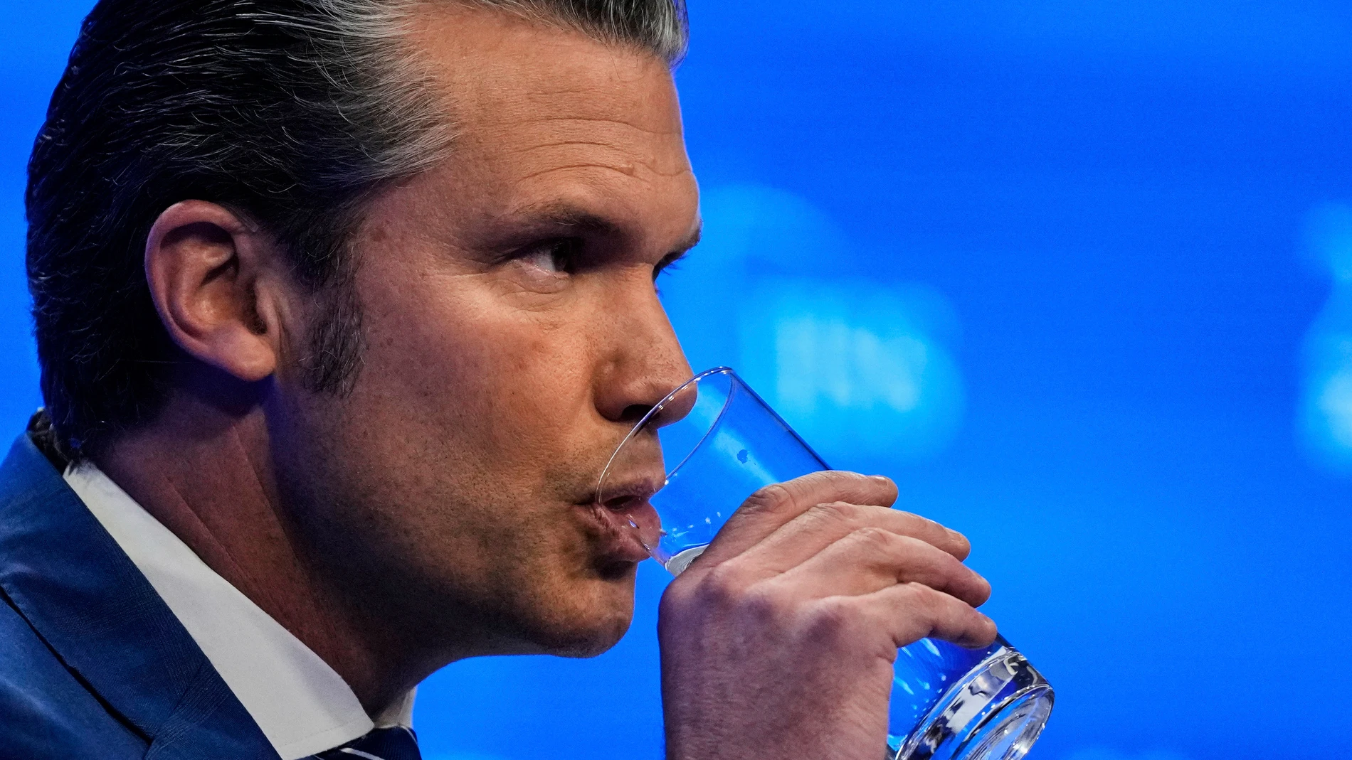 U.S. Defense Secretary Pete Hegseth drinks water during the 22nd Shangri-La Dialogue summit in Singapore, Saturday, May 31, 2025. (AP Photo/Anupam Nath)