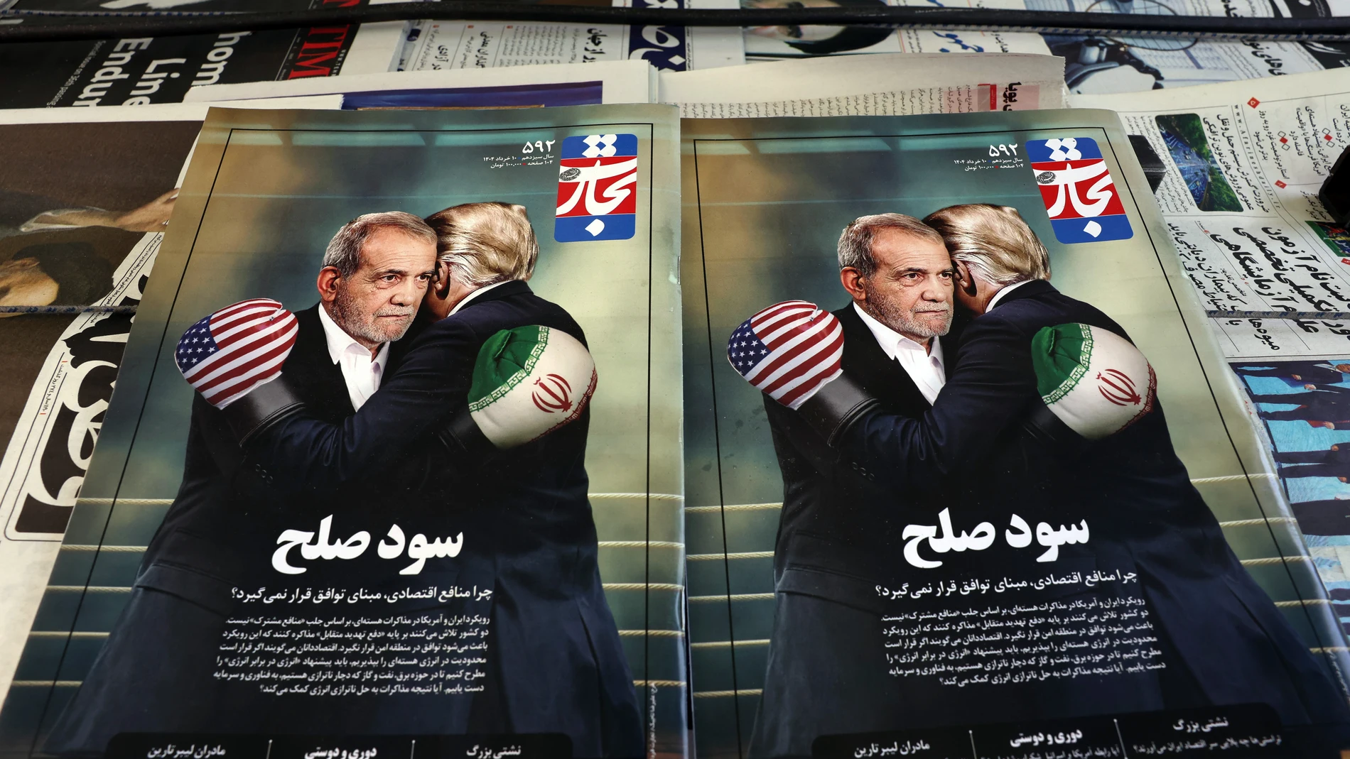 TEHRAN (IRAN(Islamic Republic Of)), 03/06/2025.- Copies of the Iranian magazine Tejarat Farda, titled 'The benefit of peace,' features an image of Iranian President Masoud Pezeshkian and US President Donald Trump embracing while wearing boxing gloves at a kiosk in Tehran, Iran, 03 June 2025. On 02 June 2025, Trump stated he ruled out allowing Iran to enrich uranium under a potential new nuclear deal between Iran and the US. According to the IRNA news agency, Pezeshkian said on 03 June 2025, t...