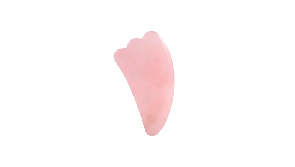 Piedra gua sha de cuarzo rosa.