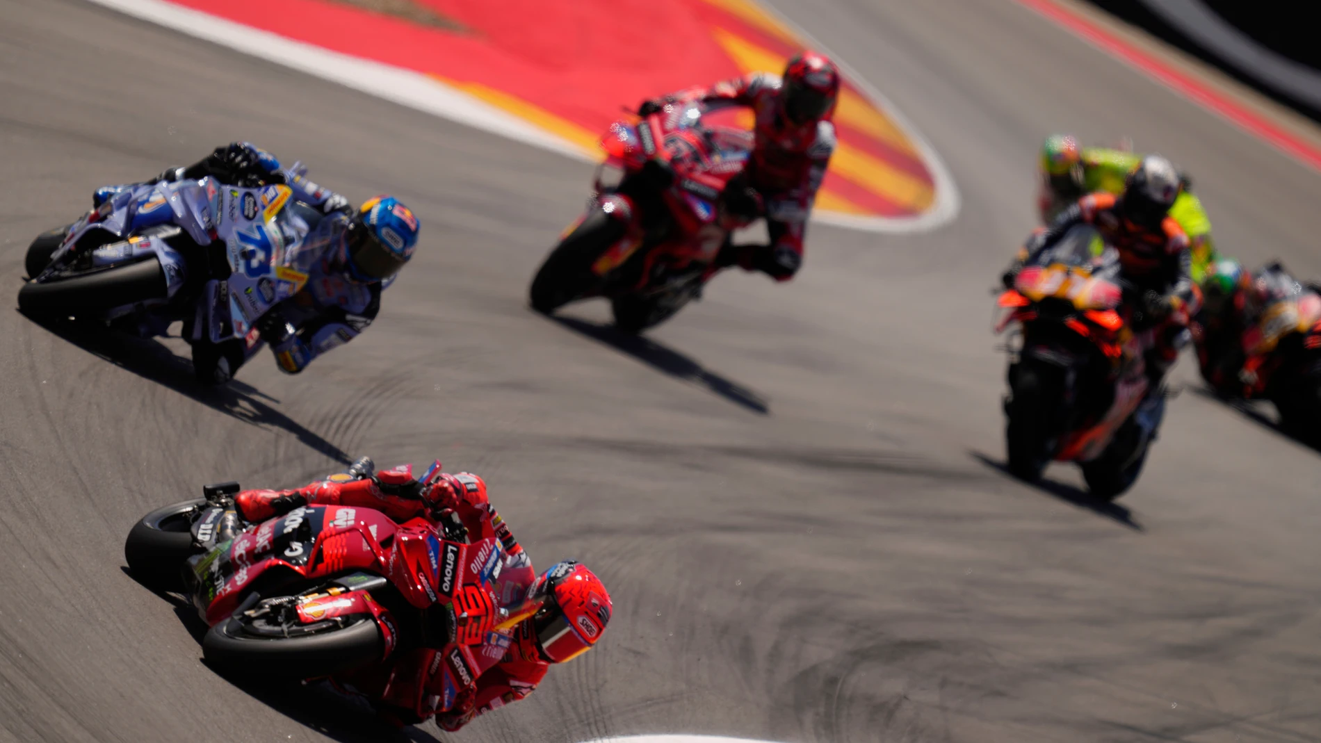 Spain's rider Marc Marquez of the Ducati Lenovo Team steers his motorcycle followed by Spain's rider Alex Marquez of the BK8 Gresini Racing MotoGP AND Italian rider Francesco Bagnaia of the Ducati Lenovo Team during the MotoGP race of the Grand Prix of Aragon at the MotorLand Aragon circuit, in Alcaniz, Spain, Sunday, June 8, 2025. (AP Photo/Jose Breton)