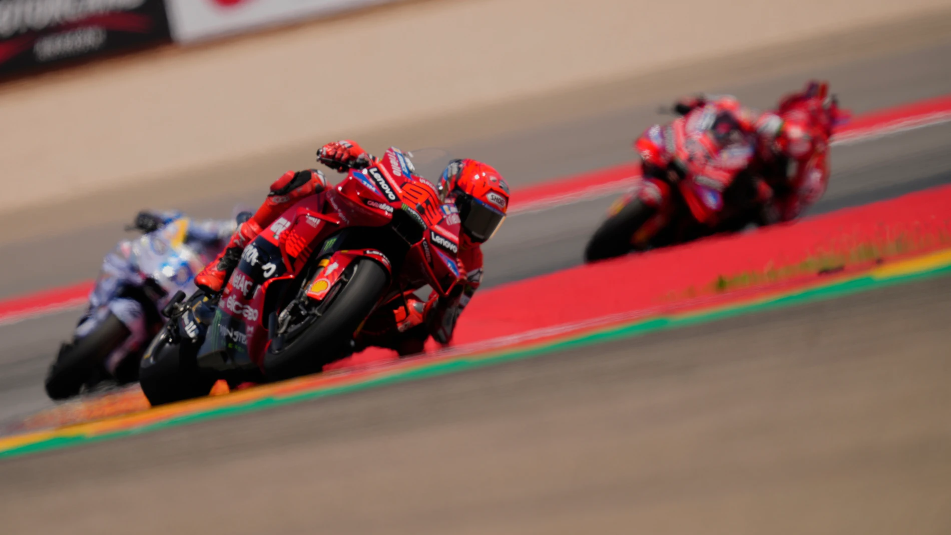 Spain's rider Marc Marquez of the Ducati Lenovo Team steers his motorcycle followed by Spain's rider Alex Marquez of the BK8 Gresini Racing MotoGP AND Italian rider Francesco Bagnaia of the Ducati Lenovo Team during the MotoGP race of the Grand Prix of Aragon at the MotorLand Aragon circuit, in Alcaniz, Spain, Sunday, June 8, 2025. (AP Photo/Jose Breton)