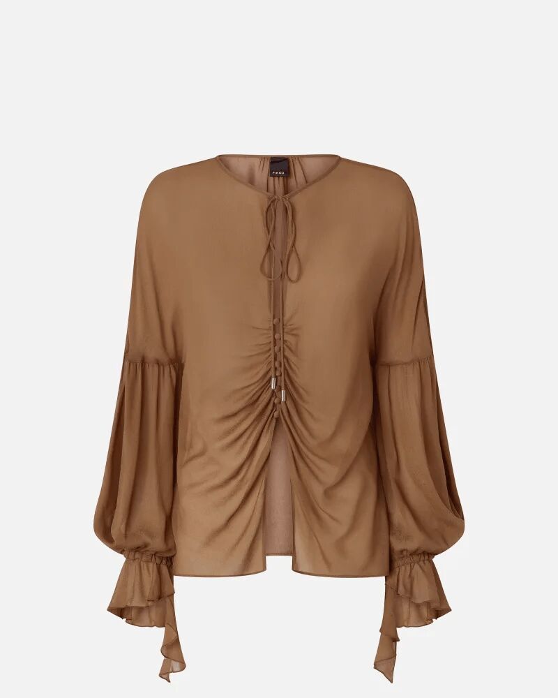 Blusa fluida con fruncidos y volantes en el puño.