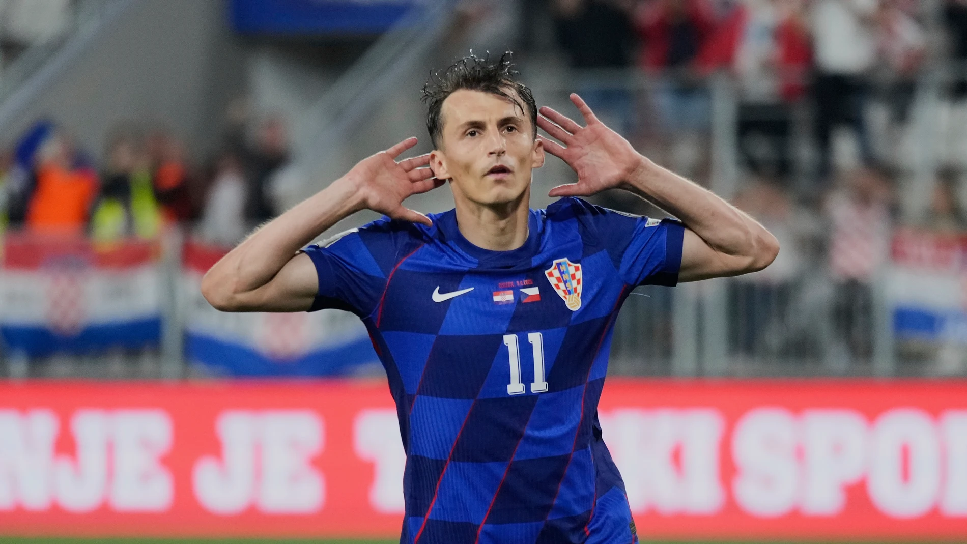 Croatia's Ante Budimir celebrates after scoring his side's fifth goal during a World Cup 2026 group L qualifying soccer match between Croatia and Czech Republic at the Opus Arena in Osijek, Croatia, Monday, June 9, 2025. (AP Photo/Darko Bandic)