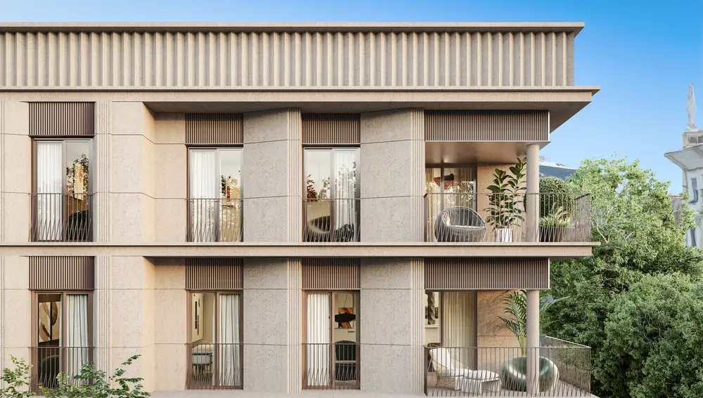 Detalle de las últimas plantas del edificio, coronado con una gran cornisa