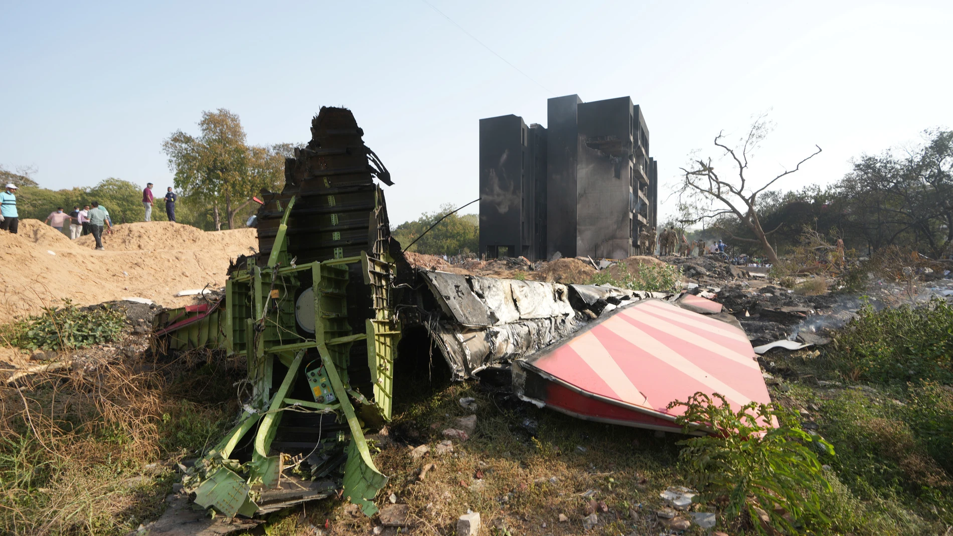 The debris of an airplane lies on a slope after it crashed in India's northwestern city of Ahmedabad in Gujarat state, Thursday, June 12, 2025. (AP Photo/Ajit Solanki)