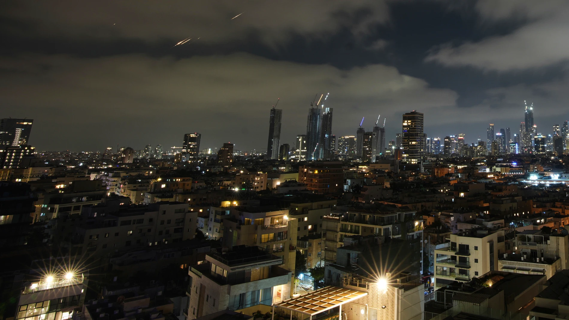Traces are seen from Tel Aviv during a missile attack, Israel, on Saturday, June 14, 2025. (AP Photo/Ohad Zwigenberg)