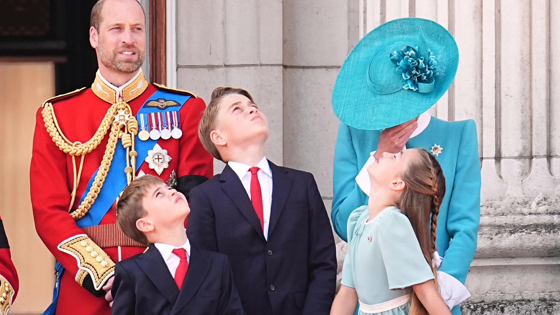 From left, Prince William, Prince Louis, Prince George, Kate, the Princess of Wales and Princess Charlotte stand on the balcony of Buckingham Palace to view the flypast following the Trooping the Colour the king's annual birthday parade, in London, Saturday, June 14, 2025. (Aaron Chown/PA via AP)