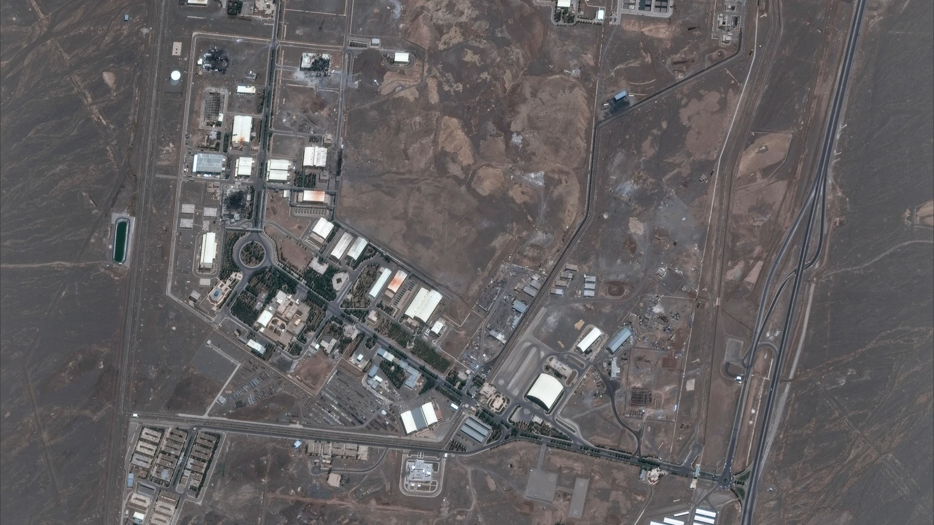 This satellite image provided by Maxar Technologies shows the Natanz nuclear enrichment facility, where multiple buildings were destroyed from recent Israeli airstrikes, 135 miles southeast of Tehran, Iran, Saturday, June 14, 2025. (Maxar Technologies via AP)