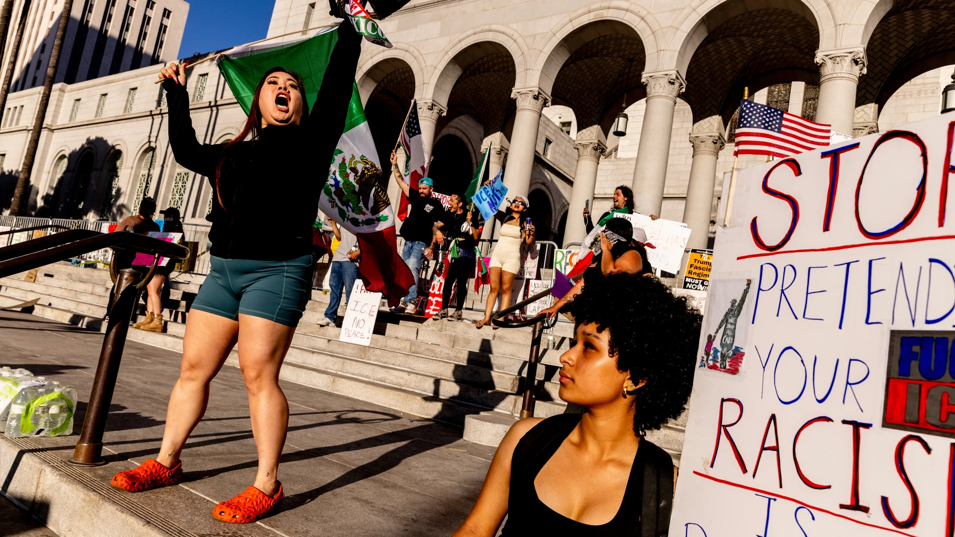 Protesters rally outside City Hall in response to a series of United States Immigration and Customs Enforcement (ICE) raids, in Los Angeles, Calif., Sunday, June 15, 2025. (Stephen Lam/San Francisco Chronicle via AP)