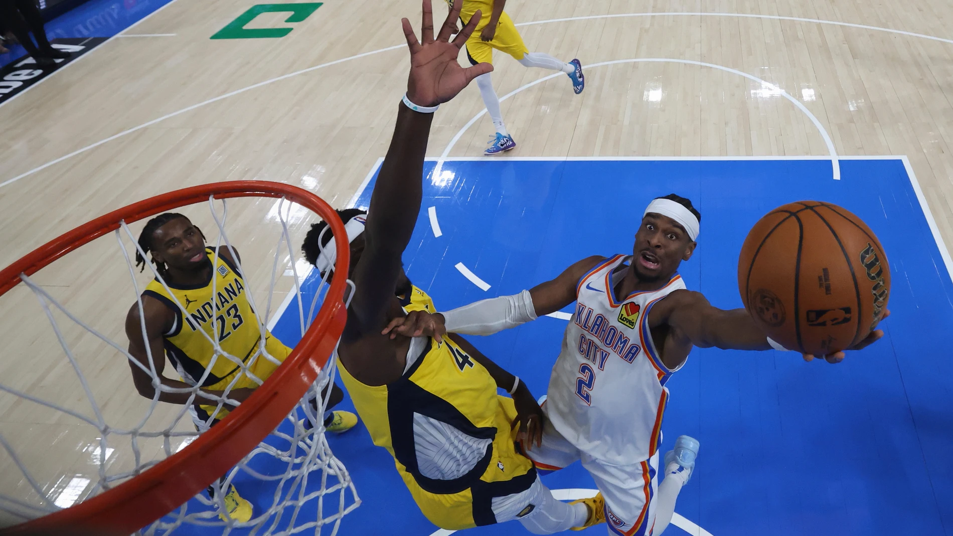 Oklahoma City Thunder guard Shai Gilgeous-Alexander (2) shoots around Indiana Pacers forward Pascal Siakam during the second half of Game 5 of the NBA Finals basketball series, Monday, June 16, 2025, in Indianapolis. (Matthew Stockman/Pool Photo via AP)