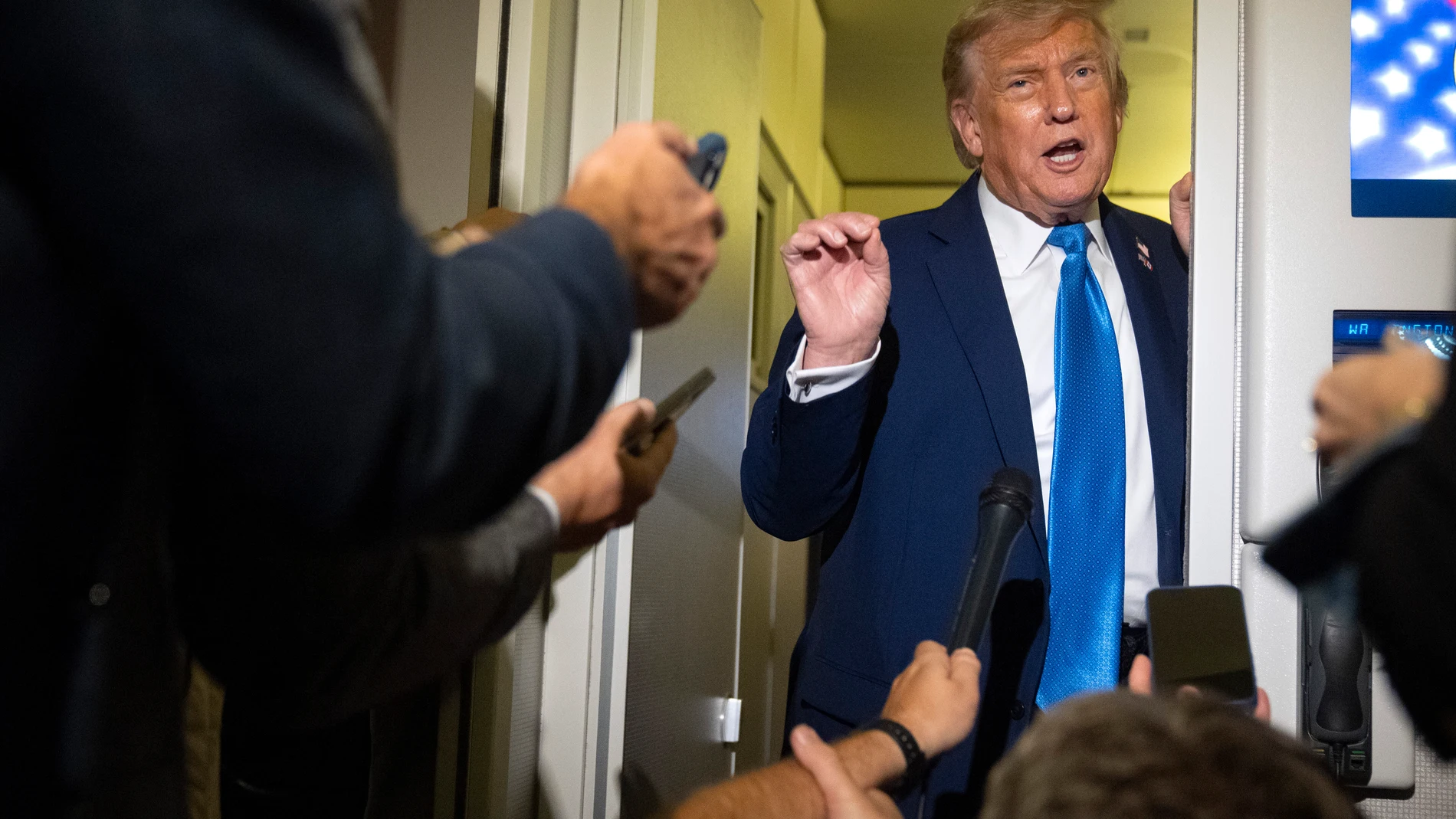 President Donald Trump speaks with reporters while flying aboard Air Force One en route from Calgary, Canada to Joint Base Andrews, Md., late Monday, June 16, 2025. (AP Photo/Mark Schiefelbein)