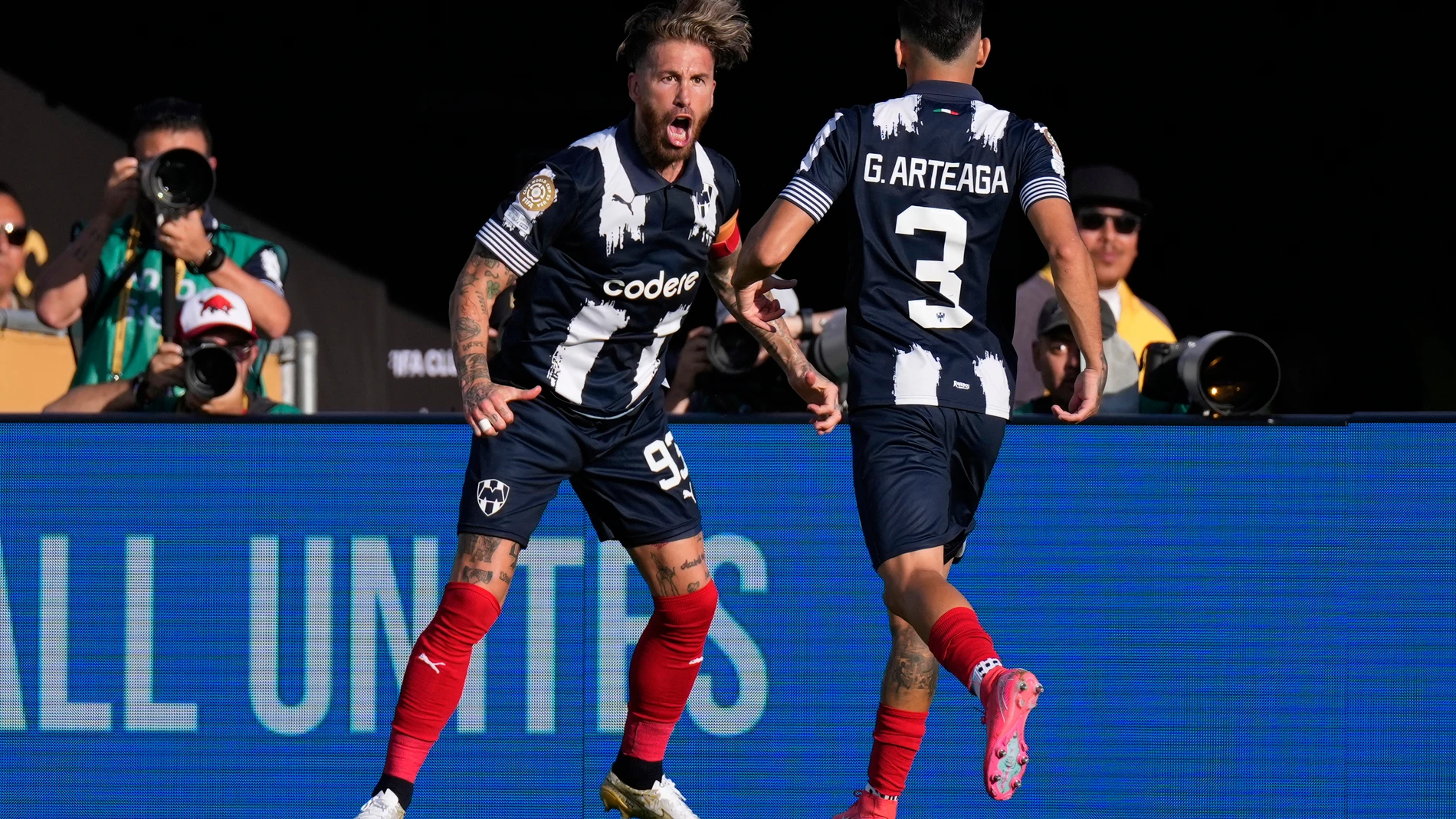Monterrey's Sergio Ramos, left, celebrates with Gerardo Arteaga after scoring the opening goal during the Club World Cup group E soccer match between CF Monterrey and Inter Milan in Pasadena, Calif., Tuesday, June 17, 2025. (AP Photo/Mark J. Terrill)
