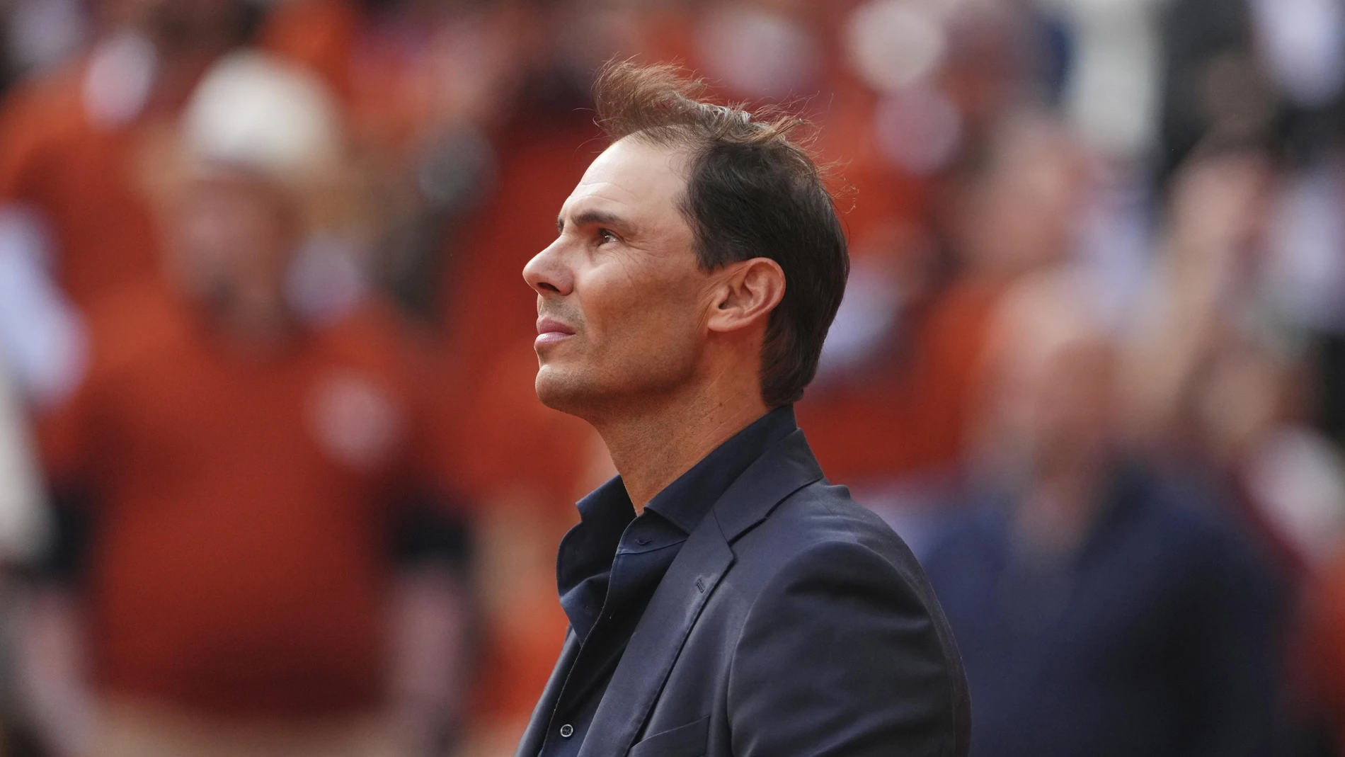Rafa Nadal looks up to fans during a farewell ceremony at center court Philippe-Chatrier, at the Roland-Garros stadium, in Paris, Sunday May 25, 2025.