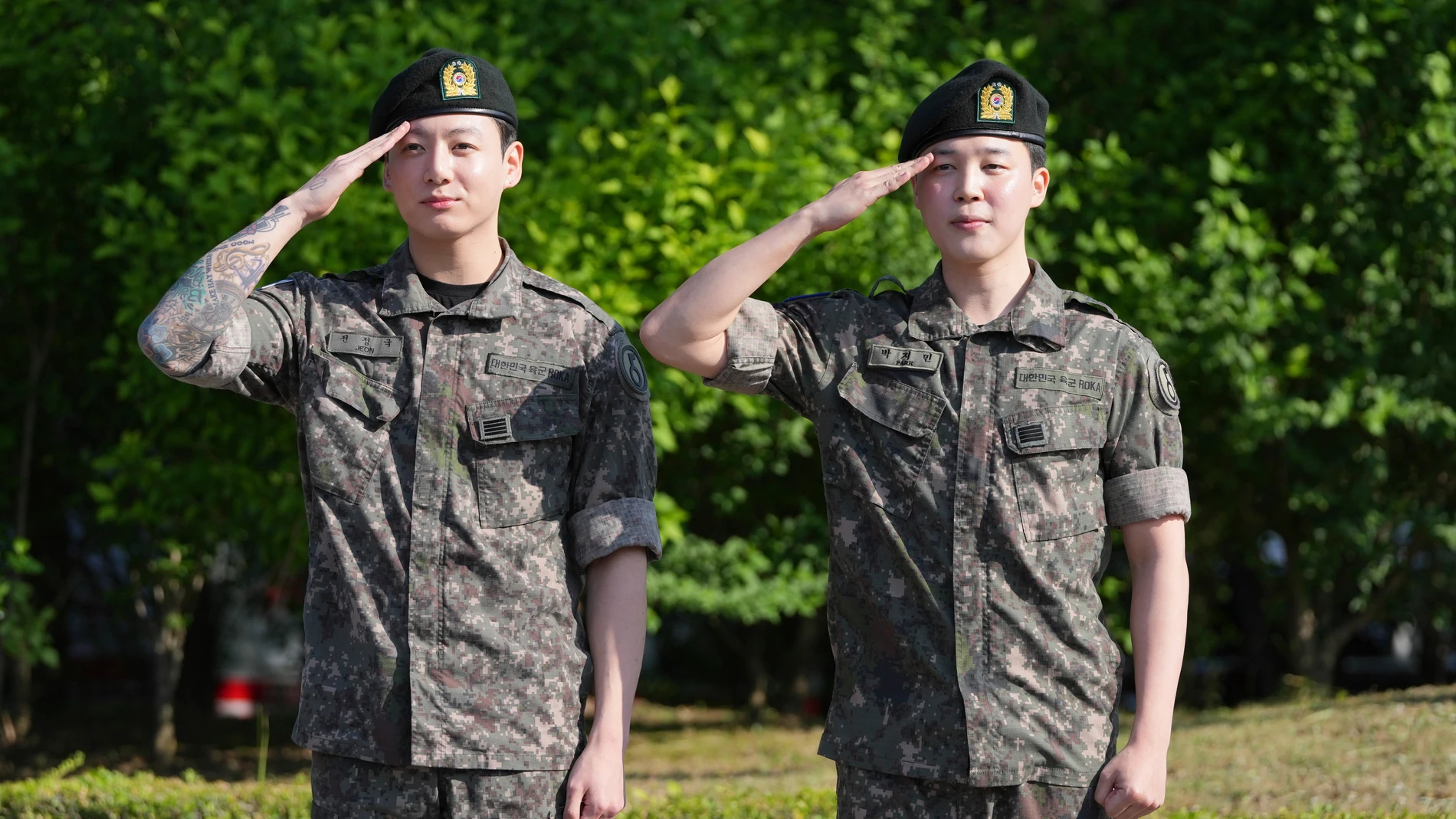 FILE - K-pop band BTS members Jimin, right, and Jung Kook salute after being discharged from a mandatory military service in Yeoncheon, South Korea, Wednesday, June 11, 2025. (AP Photo/Lee Jin-man, File)