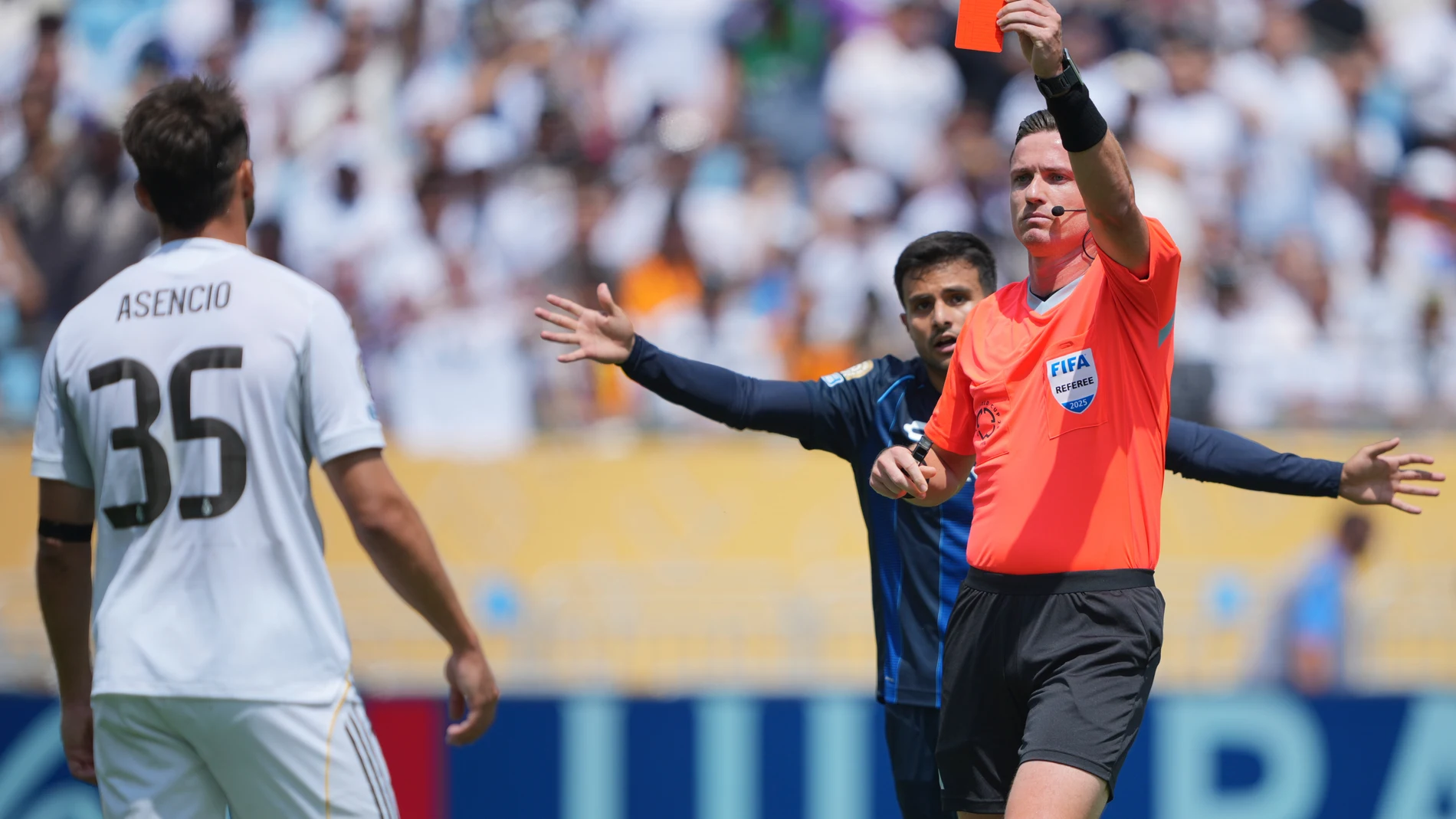 Referee Ramon Abatt shows a red card to Real Madrid's Raul Asencio during the Club World Cup Group H soccer match between Real Madrid and CF Pachuca in Charlotte, N.C., Sunday, June 22, 2025. (AP Photo/Chris Carlson)