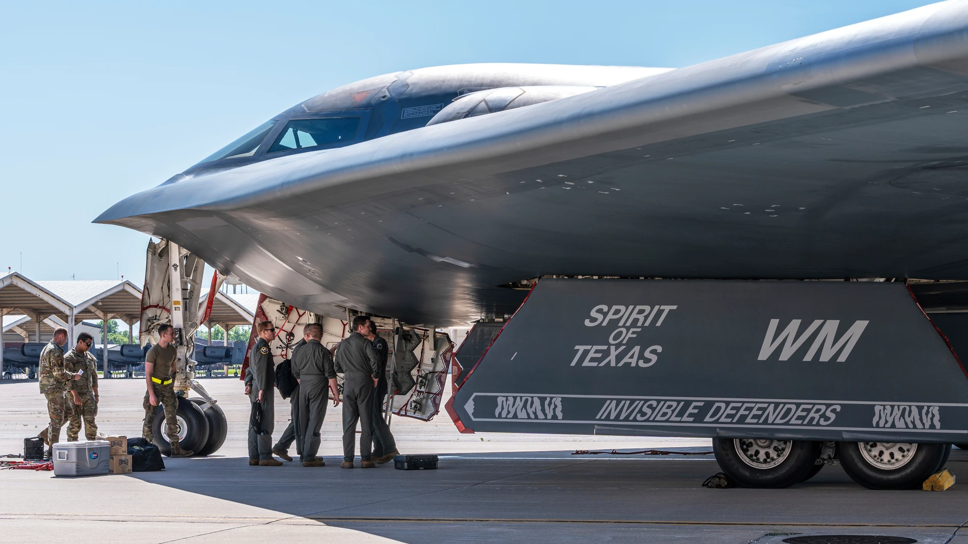 In this image provided by the U.S. Air Force, airmen assigned to the 509th Bomb Wing gather near a B-2 Spirit to greet aircrew members at Whiteman Air Force Base, Mo., May 9, 2025, upon return from deployment to Diego Garcia. (Staff Sgt. Joshua Hastings/U.S. Air Force via AP)