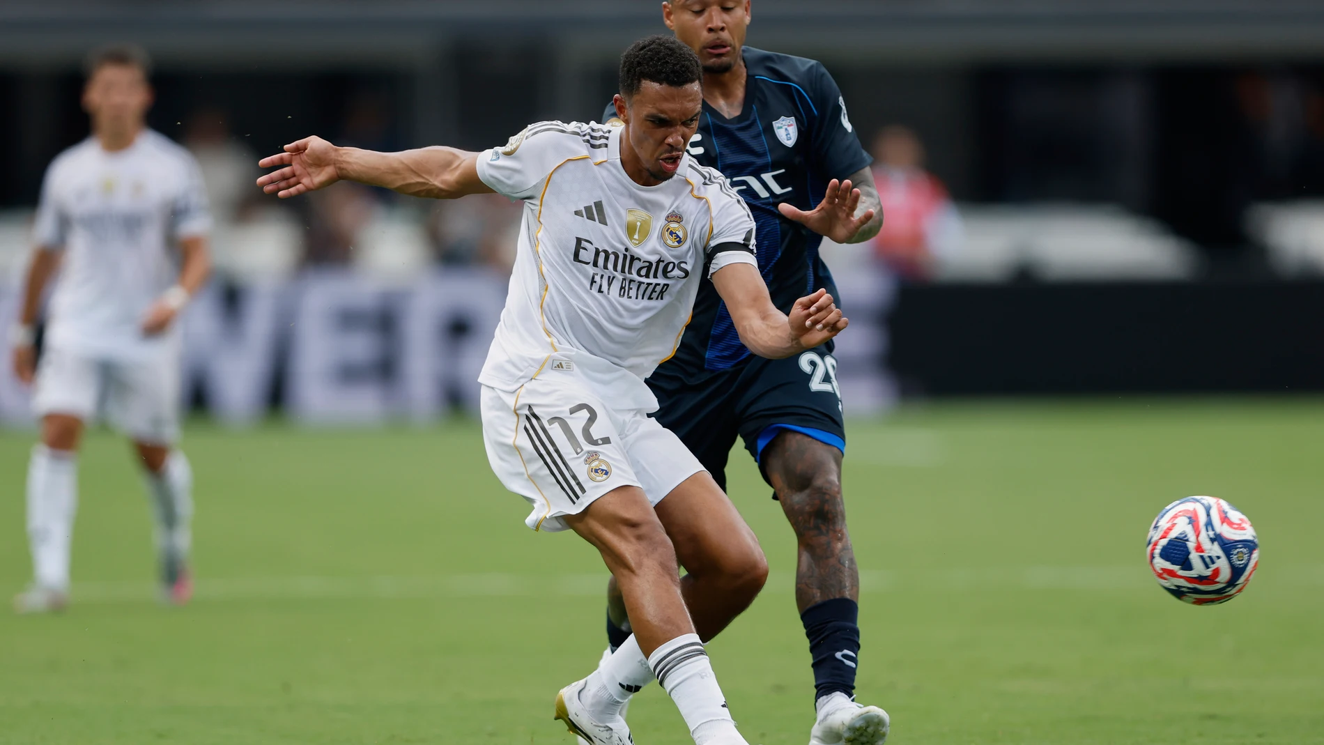 Real Madrid's Trent Alexander-Arnold shoots by Pachuca's Alan Bautista during the Club World Cup Group H soccer match between Real Madrid and CF Pachuca in Charlotte, N.C., Sunday, June 22, 2025. (AP Photo/Nell Redmond)