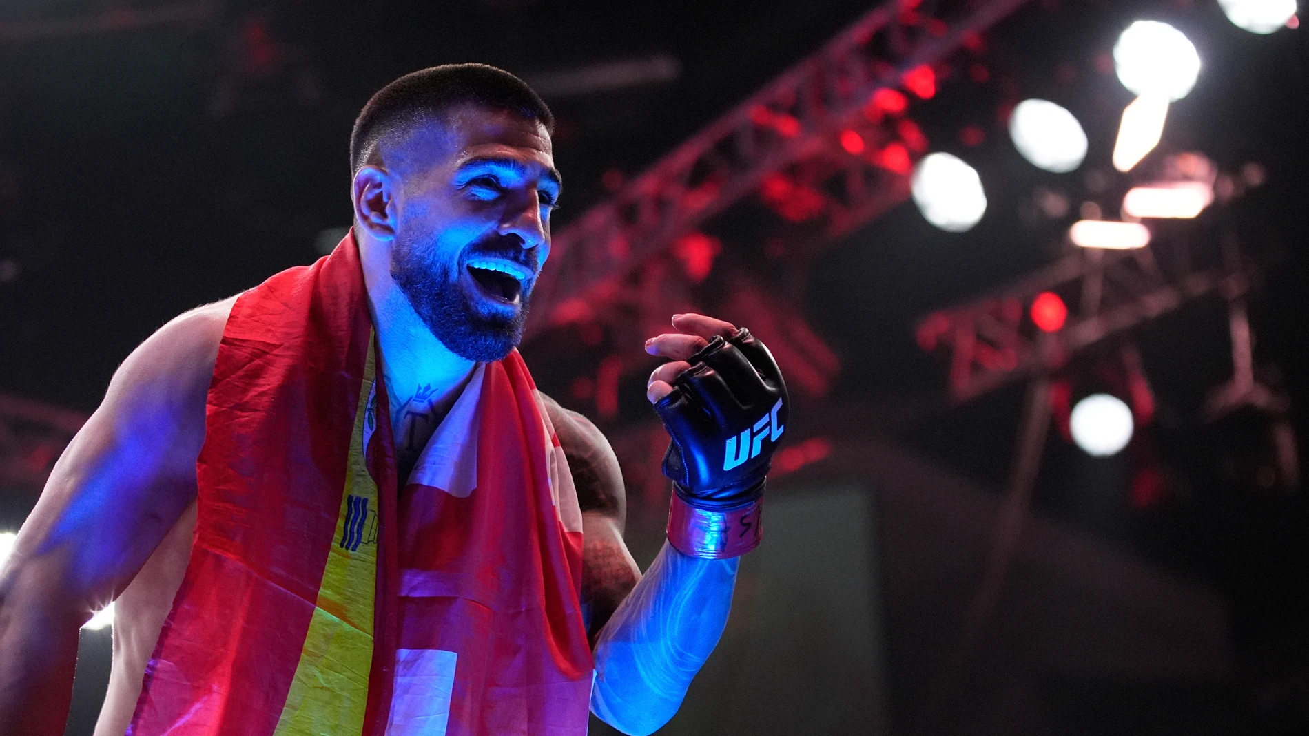 Ilia Topuria celebrates after defeating Charles Oliveira in a lightweight title fight at UFC 317, Saturday, June 28, 2025, in Las Vegas. (AP Photo/John Locher)