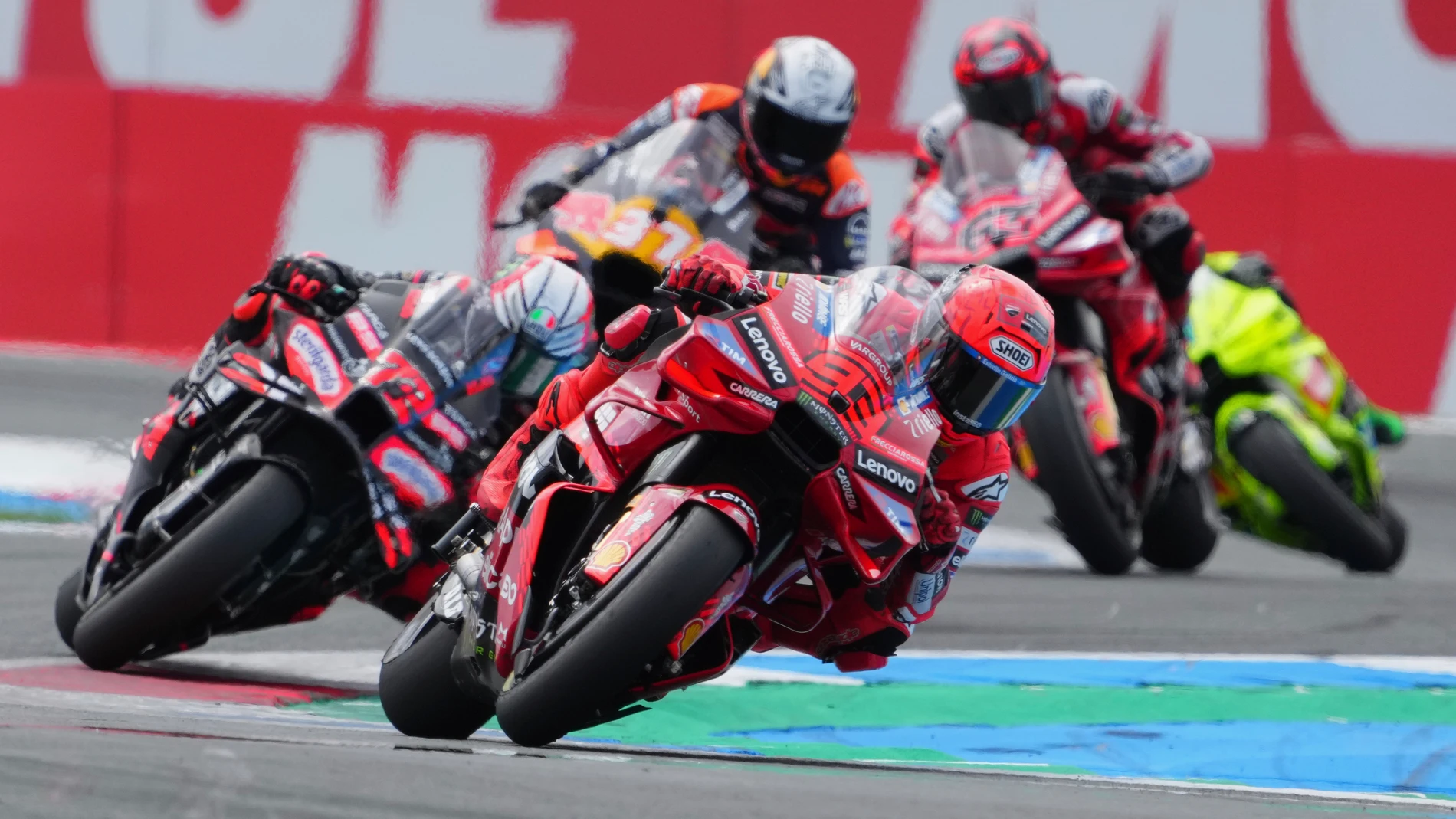 Spain's rider Marc Marquez of the Ducati Lenovo Team steers his motorcycle followed by Italian rider Marco Bezzecchi of the Aprilia Racing and Spain's rider Pedro Acosta of the Red Bull KTM Factory Racing during the MotoGP race at the Grand Prix of the Netherlands at the TT Circuit in Assen, northern Netherlands, Sunday, June 29, 2025. (AP Photo/Peter Dejong)