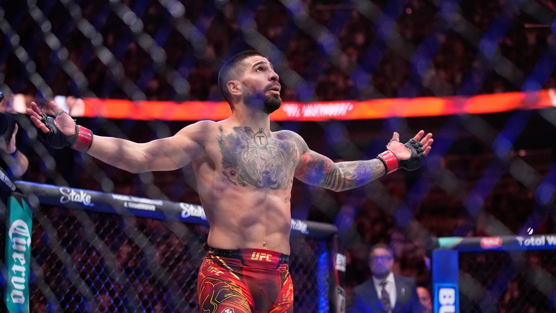 Ilia Topuria celebrates after defeating Charles Oliveira in a lightweight title fight at UFC 317, Saturday, June 28, 2025, in Las Vegas. (AP Photo/John Locher)