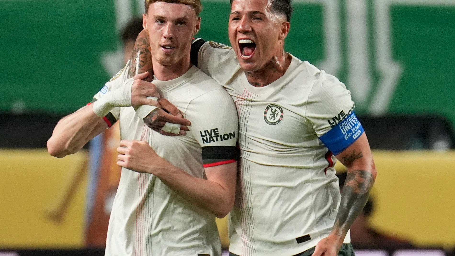 Chelsea's Cole Palmer, left, is congratulated by Enzo Fernandez after scoring his side's first goal against Palmeiras during the Club World Cup quarterfinal soccer match between Palmeiras and Chelsea in Philadelphia, Friday, July 4, 2025. (AP Photo/Chris Szagola)