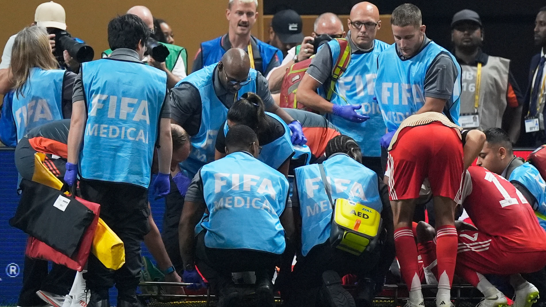 Bayern Munich's Jamal Musiala gets medical assistance during the Club World Cup quarterfinal soccer match between PSG and Bayern Munich in Atlanta, Saturday, July 5, 2025. (AP Photo/Mike Stewart)