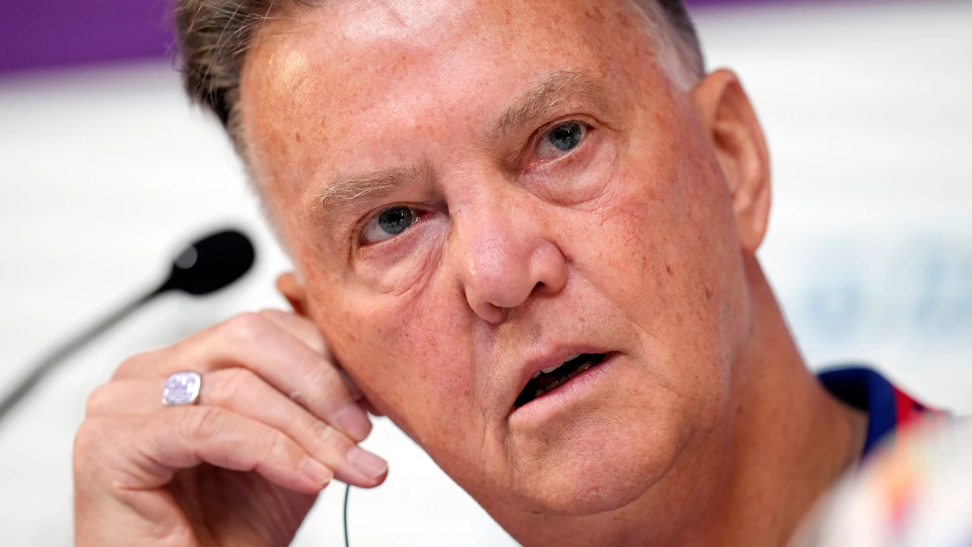 FILE - Head coach Louis van Gaal of the Netherlands adjusts his audio device during Netherlands official press conference on the eve of World Cup soccer match between Netherlands and Argentina in Doha, Qatar, Dec. 8, 2022. (AP Photo/Eugene Hoshiko, File)