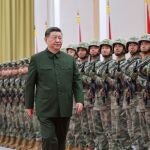 Chinese President Xi Jinping, general secretary of the Communist Party of China Central Committee and chairman of the Central Military Commission, reviews troops of the Chinese People's Liberation Army (PLA) garrison stationed in the Macao Special Administrative Region in Macau, China
