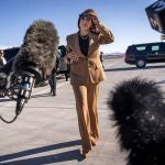 Democratic presidential nominee Vice President Kamala Harris walks toward reporters to speak before boarding Air Force Two, as she departs Las Vegas from Harry Reid International Airport, Thursday, Oct. 10, 2024, en route to Arizona. 