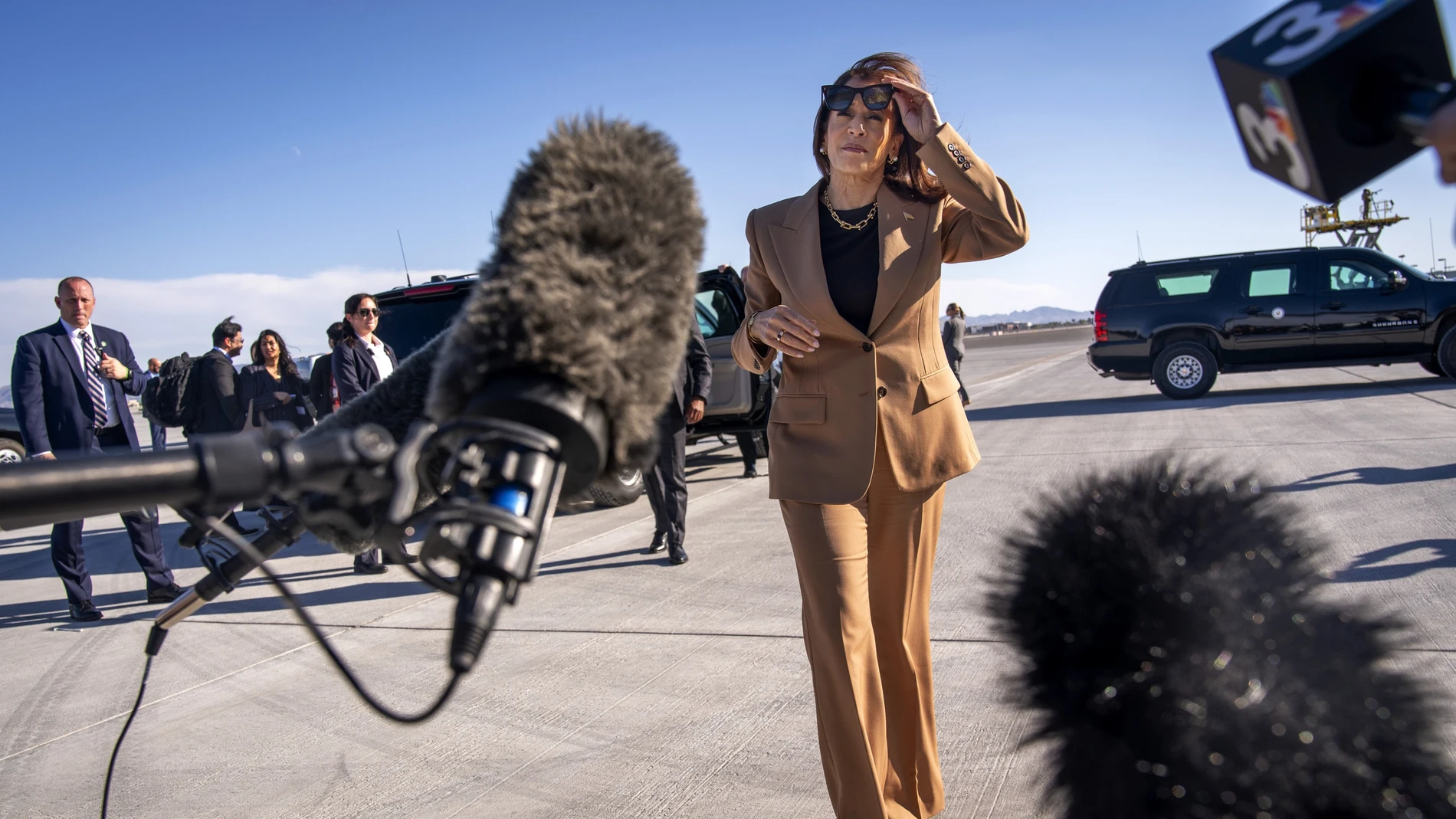 Democratic presidential nominee Vice President Kamala Harris walks toward reporters to speak before boarding Air Force Two, as she departs Las Vegas from Harry Reid International Airport, Thursday, Oct. 10, 2024, en route to Arizona.