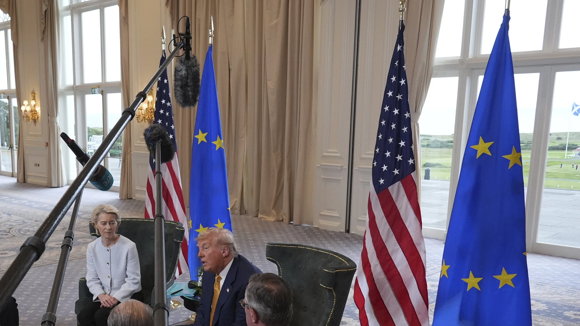 Journalists hold their microphones as President Donald Trump meets European Commission President Ursula von der Leyen at the Trump Turnberry golf course in Turnberry, Scotland Sunday, July 27, 2025.
